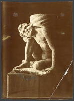 Seated boy, supports a column